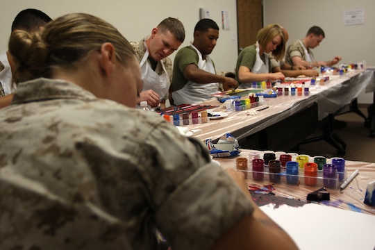 Marines paint canvases during a Art 4 Healing class at Camp Pendleton's Behavioral and Deployment Health center, Oct. 17. The program is designed to support emotional healing through are and creative expression for those living with pain, grief, fear or stress.