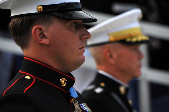 Sgt. Dakota Meyer, the first living Marine Medal of Honor recipient since the Vietnam War, stands on Center Walk with Gen. James F. Amos, the commandant of the Marine Corps, before being presented with his official Medal of Honor flag at Marine Barracks Washington Sept. 16, 2011. Meyer was presented the Medal of Honor by President Barrack Obama the previous day.