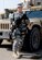 Tech. Sgt. Nicole Wrisley, 332nd Expeditionary Security Forces area supervisor, stands in front of a Humvee tactical vehicle at Joint Base Balad, Iraq. Wrisley is deployed from Beale Air Force Base, Calif., and is on her second deployement to JB Balad since 2009 and has witnessed the changes the base has undergone since that time. (U.S. Air Force photo by Senior Airman Jeffrey Schultze)