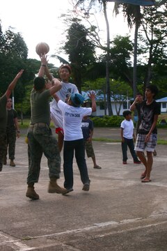 Filipino children from the Bahay Ni Nanay Orphanage play basketball with U.S. Marines and sailors on Antonio Bautista Air Base in Puerto Princesa, April 21, 2012. The children and service members spent several hours together getting to know one another. The service members are currently here for the duration of Balikatan 2012 and are part of Task Force Palawan. BK12 is a bilateral, joint exercise conducted annually between the U.S. and the Republic of the Philippines. This year marks the 28th iteration of the nations' exercise.