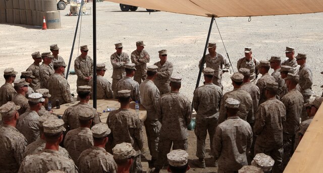 Marines and sailors with 2nd Explosive Ordnance Disposal Company, 1st Marine Logistics Group (Forward) listen to Brig. Gen. John Broadmeadow, (center), 1st MLG (Fwd) Commanding General at the EOD compound on Camp Leatherneck, April 24. Brig. Gen. Broadmeadow stopped by the EOD compound to thank the Marines and congratulate them on a successful deployment. During their tour, the company completed more than 2,800 total responses, responded to 740 IED calls and neutralized over 1,000 IEDs. Additionally, the company turned in more than 1,500 bags of evidence for further exploitation and trained nearly 10,000 personnel.