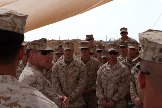 Brig. Gen. John Broadmeadow, (center left), 1st Marine Logistics Group (Forward) Commanding General, thanks Marines and sailors with 2nd Explosive Ordnance Disposal Company and congratulates them on a successful deployment, April 24. Second EOD Co. is wrapping up a six month deployment to Helmand Province, Afghanistan.