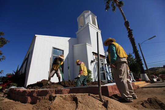 Volunteers from the Church of Latter Day Saints help spruce up the Camp Pendleton's School of Infantry West's Caruso Memorial Chapel, April 28. Sixty church members volunteered their time to give a "much needed" update to the more than 50 year-old chapel. The chapel is used for various purposes, including SOI students who attend different religious services, chaplain meetings and church-group gatherings.
