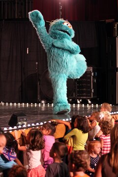 Rosita, a bilingual monster, dances and sings in English and Spanish while her little fans sing and dance along at the Sesame Street/USO Experience for Military Families at the Bulldog Box Office, Marine Corps Base Camp Pendleton, Aug. 14.
