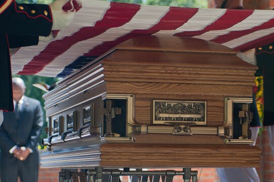 The flag over top of the casket of Henry H. Black, seventh sergeant major of the Marine Corps, gets prepared for folding and presentation to Mrs. Fannie Black, Black’s wife, during his funeral ceremony at Marine Corps Base Quantico, Va., Aug. 29. Black passed away in his home in Fredericksburg, Va., Aug. 24. He served in Korea and Vietnam and earned a Silver Star, Bronze Star, Purple Heart, and Combat Action Ribbon.