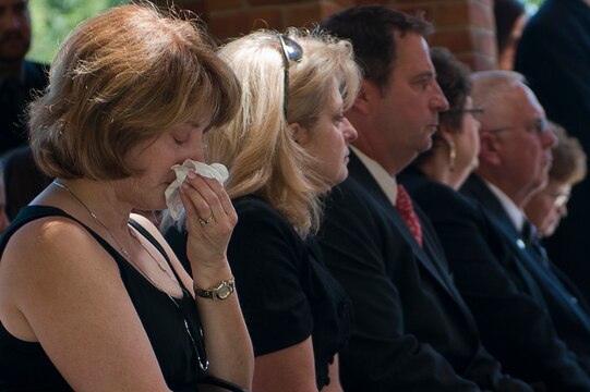 A family member of Henry H. Black, seventh sergeant major of the Marine Corps, cries during the funeral ceremony at Marine Corps Base Quantico, Va., Aug. 29. Black passed away in his home in Fredericksburg, Va., Aug. 24. He served in Korea and Vietnam and earned a Silver Star, Bronze Star, Purple Heart, and Combat Action Ribbon.