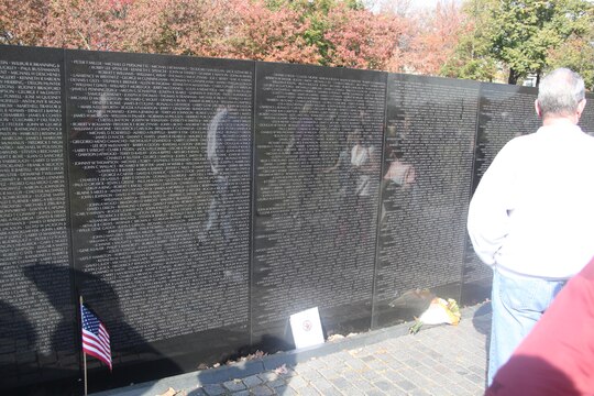Tourist visit the Vietnam Memorial to pay their respects to the those killed or missing in action from the war in Washington D.C. Nov. 10. More than 58,200 names are carved into the wall. 