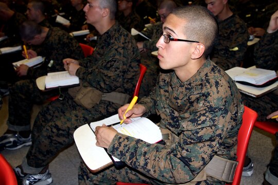A recruit of Company G, 2nd Recruit Training Battalion pays close attention during the history class aboard Marine Corps Recruit Depo San Diego, Dec. 10.  The class is the third part of a six-part series that teaches recruits everything from the birth of the Marine Corps up to the recent wars in Iraq and Afghanistan.