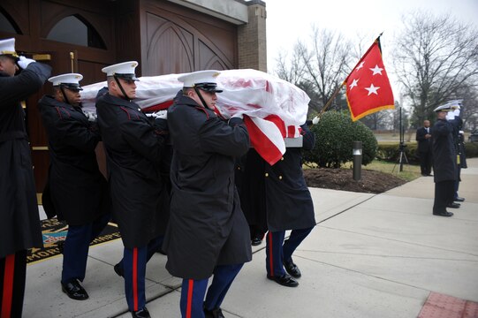 Marine Corps Body Bearers carry the casket of Gen. Samuel Jaskilka (1919-2012), 16th assistant commandant of the Marine Corps, to the caisson before it is delivered to the grave site at Arlington National Cemetery Jan. 26. Jaskilka joined the Marine Corps reserves as a second lieutenant in 1942 and served as the assistant commandant from 1975 until he retired in 1978. Jaskilka was also honored with a flyover of four MV-22 Ospreys during the ceremony. Jaskilka’s awards include the Navy Distinguished Service Medal, two Silver Star Medals, a Legion of Merit, a Bronze Star Medal with a valor device, a World War II Victory Medal, seven Vietnam Service Medals and a United Nations Korea Medal.::r::::n::