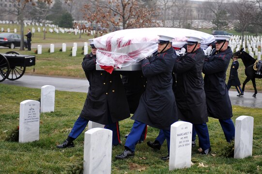 Marine Corps Body Bearers from Marine Barracks Washington carry the casket of Gen. Samuel Jaskilka (1919-2012), the 16th assistant commandant of the Marine Corps, to its final resting place at Arlington National Cemetery Jan. 26. Jaskilka joined the Marine Corps reserves as a second lieutenant in 1942 and served as the assistant commandant from 1975 until he retired in 1978. Jaskilka was also honored with a flyover of four MV-22 Ospreys during the ceremony. Jaskilka’s awards include the Navy Distinguished Service Medal, two Silver Star Medals, a Legion of Merit, a Bronze Star Medal with a valor device, a World War II Victory Medal, seven Vietnam Service Medals and a United Nations Korea Medal.::r::::n::