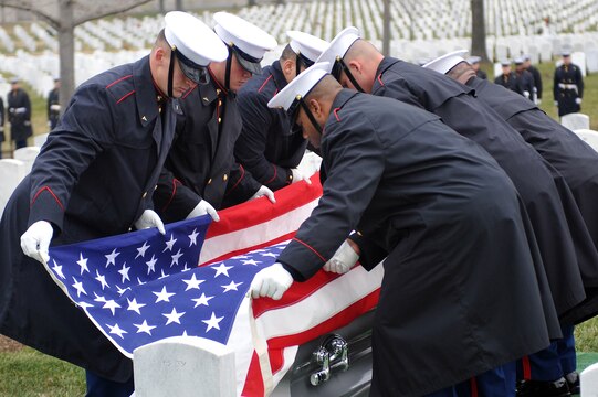 Marine Corps Body Bearers from Marine Barracks Washington lift the flag off the casket of Gen. Samuel Jaskilka (1919-2012), the 16th assistant commandant of the Marine Corps, during his funeral service at Arlington National Cemetery Jan. 26. Jaskilka joined the Marine Corps reserves as a second lieutenant in 1942 and served as the assistant commandant from 1975 until he retired in 1978. Jaskilka was also honored with a flyover of four MV-22 Ospreys during the ceremony. Jaskilka’s awards include the Navy Distinguished Service Medal, two Silver Star Medals, a Legion of Merit, a Bronze Star Medal with a valor device, a World War II Victory Medal, seven Vietnam Service Medals and a United Nations Korea Medal.::r::::n::