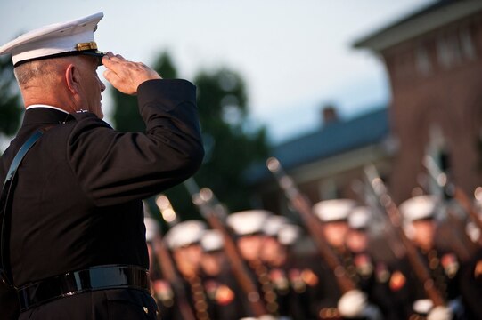 Lt. Gen. Dennis Hejlik, commanding general of Marine Forces Europe and Marine Corps Forces Command, salutes the Marines of the parade as the march passed in review during his retirement ceremony at Marine Barracks Washington July 23. Hejlik was awarded the Distinguished Service Medal during the ceremony for 44 years of dedicated service to Corps and country.