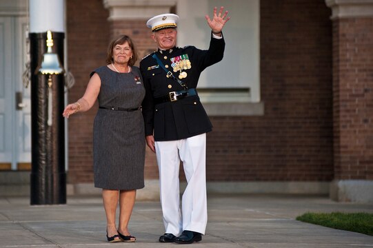 Lt. Gen. Dennis Hejlik, commanding general of Marine Forces Europe and Marine Corps Forces Command, and his wife, Sandy, wave goodbye to the Marine Corps after 44 years of service at the conclusion of Hejlik's retirement ceremony at Marine Barracks Washington July 23. Hejlik was awarded the Distinguished Service Medal for his dedicated service.