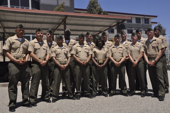 Marine volunteer Devil Pups instructors gather for a group photograph during the the Devil Pups graduation ceremony on Camp Pendleton's 52 Area Parade Deck, July 28.