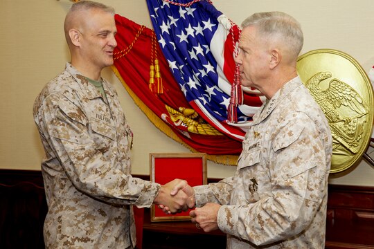 Brig. Gen. John J. Broadmeadow, Commanding General, 1st Marine Logistics Group (Forward), talks to Marines and sailors with Personal Security Detachment, 1st MLG (Fwd), and other convoy members at Forward Operating Base Zeebrugge before driving back to Camp Leatherneck, Afghanistan, Aug. 1. “As the leader of the MLG, it’s important for me to understand what our Marines go through, and I need to see that first hand myself,” said Brig. Gen. Broadmeadow. “What the PSD does for me, it allows me to experience what our Marines experience day in and day out.”