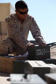 Cpl. Stevie Leos, an ammunition technician with Supply Company, 1st Maintenance Battalion (-) (Reinforced), 1st Marine Logistics Group (Forward), counts a load of ammunition at the new Munitions Storage Area at Camp Leatherneck, Afghanistan. During a mass movement to the new MSA, ammunition is counted before leaving the original Field Ammunition Supply Point and counted again once it arrives at the receiving area.