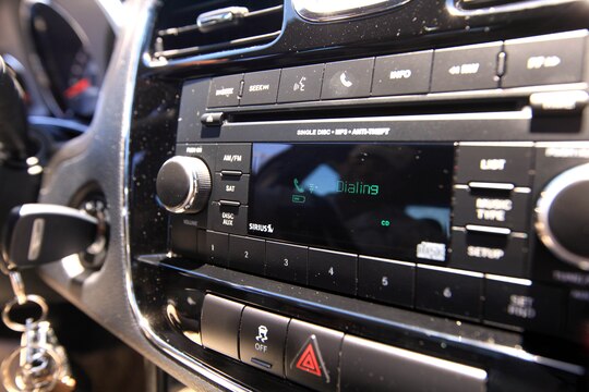 Many newer model vehicles have a built-in bluetooth or UConnect phone option which allows drivers to voice dial and recieve calls through the speakers of their vehicles. This feature gives drivers a hands-free capability of using their phone while driving and is permitted on base. (Photo illustration)