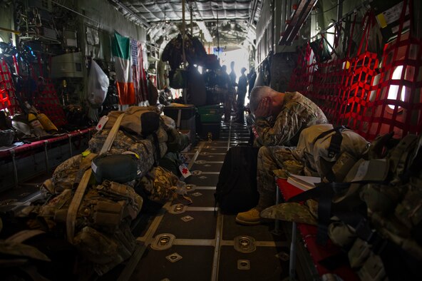 Chief Master Sgt. Robert Sealey, U.S. Air Forces Central command chief, takes a moment to grab an extra minute of sleep on a C-130 Hercules at Kandahar Airfield, Afghanistan, March 16, 2012. During his trip to Afghanistan, Sealey visited numerous locations often traveling hundreds of miles a day, flying from base to base. As command chief, Sealey seldom has "off time." (U.S. Air Force photo by Staff Sgt. David Salanitri) 

