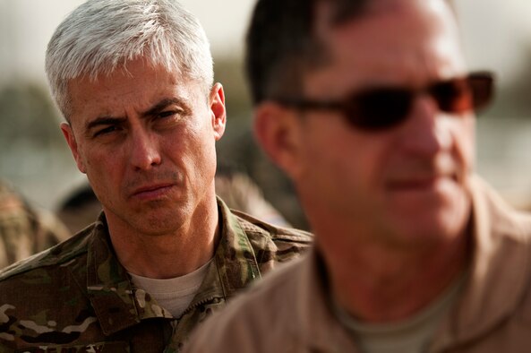 From left, Chief Master Sgt. Robert Sealey, U.S. Air Forces Central command chief, looks on as his boss, Lt. Gen. David Goldfein, Combined Forces Air Component Commander, March 15, 2012 at Kandahar Airfield, Afghanistan. As command chief, Sealey advises the commander and staff on matters influencing the health, welfare, morale, and effective utilization of assigned enlisted personnel. (U.S. Air Force photo by Staff Sgt. David Salanitri) 

