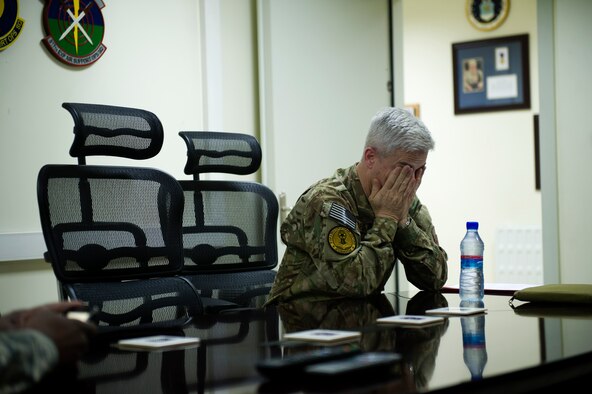 Chief Master Sgt. Robert Sealey, U.S. Air Forces Central command chief, fights off exhaustion during a trip to Kabul International Airport, Afghanistan, March 13, 2012. During his trip to Afghanistan, Sealey visited numerous locations often traveling hundreds of miles a day, flying from base to base. As command chief, Sealey seldom has "off time." (U.S. Air Force photo by Staff Sgt. David Salanitri) 

