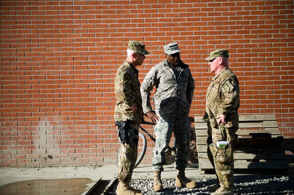 From left, Chief Master Sgt. Robert Sealey, U.S. Air Forces Central command chief, talks with Chief Master Sgt. Al Herring, 9th Air and Space Expeditionary Task Force - Afghanistan command chief, and Chief Master Sgt. John Hoffman, 438th Air Expeditionary Wing command chief, at Kabul International Airport, March 12, 2012. (U.S. Air Force photo by Staff Sgt. David Salanitri) 
