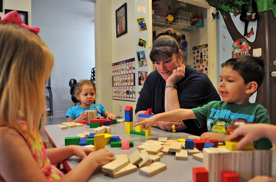 Jeanette Going watches as children play with wooden blocks on Seymour Johnson Air Force Base, N.C., May 7, 2012. Jeanette is one of a few accredited and U.S. Air Force trained home family child care providers in Wayne County, N.C. making her a valid source for military personnel and DoD civilians with child care needs. Jeanette is the spouse of Tech. Sgt. Wesley Going, 4th Equipment Maintenance Squadron aircraft ground equipment readiness NCO in charge, and hails from Bristol, Conn. (U.S. Air Force photo/Airman 1st Class Aubrey Robinson/Released)