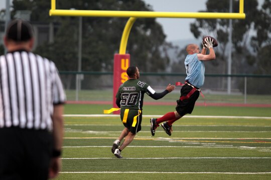 Brandon Charles intercepts a pass during the 2012 Flag Football Championship League on Camp Pendleton, May 17. "The Gators were the toughest team we have gone up against in this tournament," said Jay M. Johnson, coach of the Combat Logistics Regiment 17 Desk Jockeys. "I have to say the turning point came down to one great catch." Charles is the cornerback for Desk Jockeys.