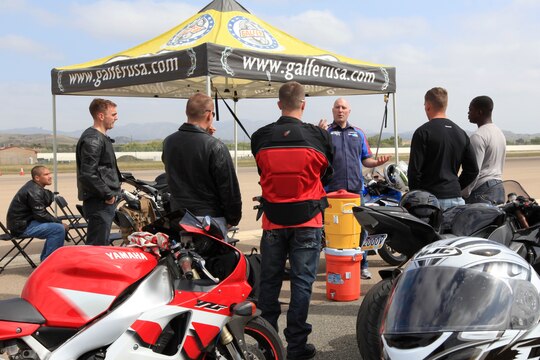 Marines from 1st Marine Division, Marine Air Group 39 and Marine Corps Air Station listen to an instructor give a class on down shifting at Semper Ride's Fun Day at the Runway on Marine Corps Air Station Camp Pendleton, May 18.