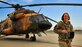Air Force Maj. Jennifer Bradley,440th Air Expeditionary Advisory Squadron flightline maintenance advisor, poses for a photo in front of an Afghan Mi-17 helicopter at Kabul, Afghanistan, International Airport, May 22, 2012. While deployed Bradley advised both male and female Afghan Air Force Officers on aircraft maintenance.  Bradley is deployed from Detachment 5 at the University of New Mexico where she is an Air Force ROTC instructor. 