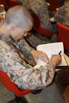 Company G recruits take notes during a Marine Corps history class May 11 aboard Marine Corps Recruit Depot. It is important recruits know the history of the Marine Corps so they understand the traditions. Many recruits come to the depot not knowing any of the knowledge they recieve during these classes.