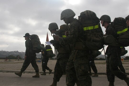 Recruits of Company E, 2nd Recruit Training Battalion, recite knowledge as they hike a sustainment hike, a six-mile hike around base, May 12 aboard Marine Corps Recruit Depot San Diego. Drill instructors use the hike to instill knowledge about Marine Corps history to help the recruits with their final exams. The hike is also used as a tool to prepare the recruits for the many miles they will travel during the Crucible, a 54-hour field-training exercise. 