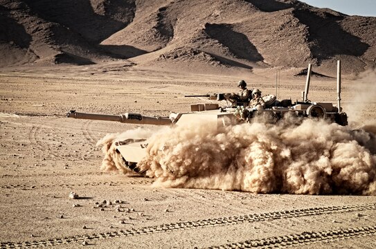An M1A1 Abrams tank with Alpha Company, 1st Tank Battalion, Regimental Combat Team 6, patrols through the desert north of the Kajaki Dam, May 31. The Marines supported Operation Branding Iron.