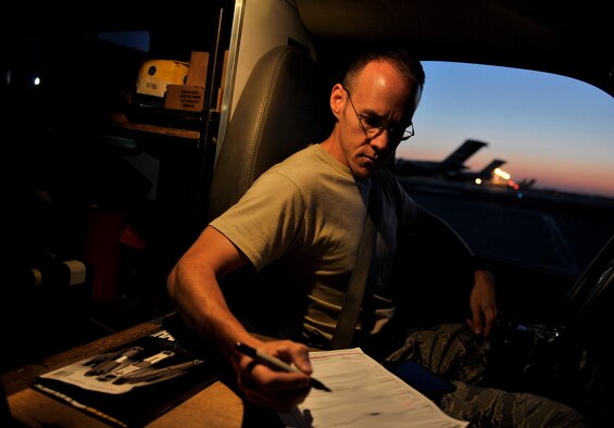 U.S. Air Force Tech. Sgt. Dallas Powers, 728th Air Mobility Squadron ,Operation Location-Alpha expediter, checks on the arrival of a C-17 Globemaster III, Transit Center at Manas, Kyrgyzstan, Sept. 15, 2012. Powers and his crew of maintainers are an important piece of keeping the C-17, with its expansive airlift and transport capabilities, operational in the AOR. The U.S. military is drawing down forces in Afghanistan and are redeploying combat forces while transitioning security control to the Afghan National Security Forces (ANSF). The ANSF and U.S. forces have worked closely and effectively to transition control of security in Afghanistan. (U.S. Air Force photo/Staff Sgt. Clay Lancaster)