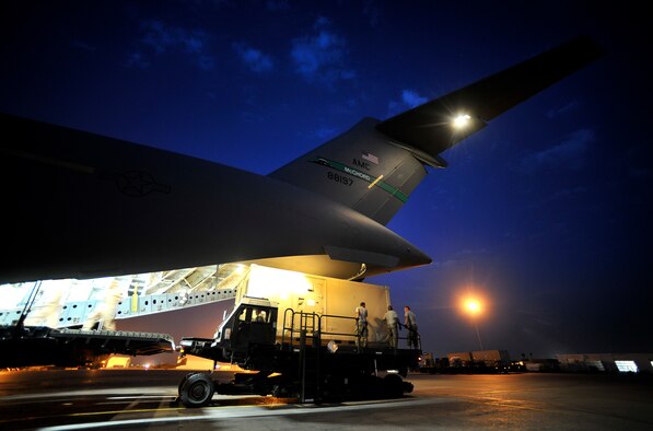 U.S. Air Force aerial port members load cargo onto a C-17 Globemaster III at a base near Mazar-e-Sharif, Afghanistan during a redeployment mission, Sept. 12, 2012. The U.S. military is drawing down forces in Afghanistan and are redeploying combat forces while transitioning security control to the Afghan National Security Forces (ANSF). The ANSF and U.S. forces have worked closely and effectively to transition control of security in Afghanistan. (U.S. Air Force photo/Staff Sgt. Clay Lancaster)