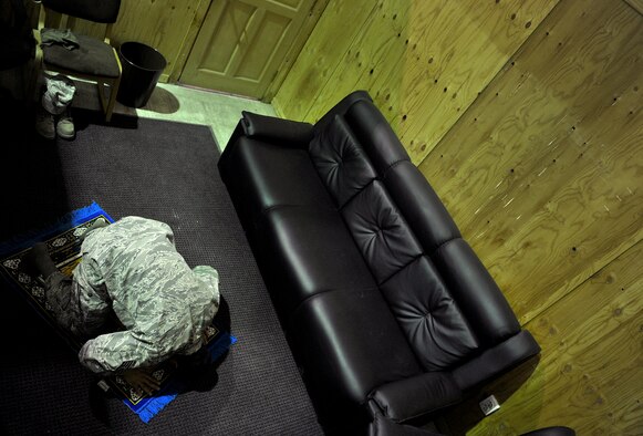 U.S. Air Force Staff Sgt. Edger Gaitan, Passenger Service NCOIC, 376th Expeditionary Logistics Readiness Squadron, prays in the distinguished visitor suite during his shift at the Passenger Terminal, Transit Center at Manas, Kyrgyzstan, Sept. 19, 2012. Gaitan spends his graveyard shift making sure deploying and redeploying U.S. and coalition members are transported properly. Gaitan is a devout Muslim who finds the time to pray daily in between mission requirements here at Manas. Gaitan has had the priveledge of serving his country while helping to mentor those around him with his strong personal values and religious beliefs. (U.S. Air Force photo/Staff Sgt. Clay Lancaster)