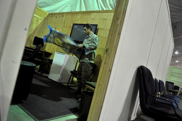 U.S. Air Force Staff Sgt. Edger Gaitan, Passenger Service NCOIC, 376th Expeditionary Logistics Readiness Squadron, prepares to pray in the distinguished visitor suite during his shift at the Passenger Terminal, Transit Center at Manas, Kyrgyzstan, Sept. 19, 2012. Gaitan spends his graveyard shift making sure deploying and redeploying U.S. and coalition members are transported properly. Gaitan is a devout Muslim who finds the time to pray daily in between mission requirements here at Manas. Gaitan has had the priveledge of serving his country while helping to mentor those around him with his strong personal values and religious beliefs. (U.S. Air Force photo/Staff Sgt. Clay Lancaster)