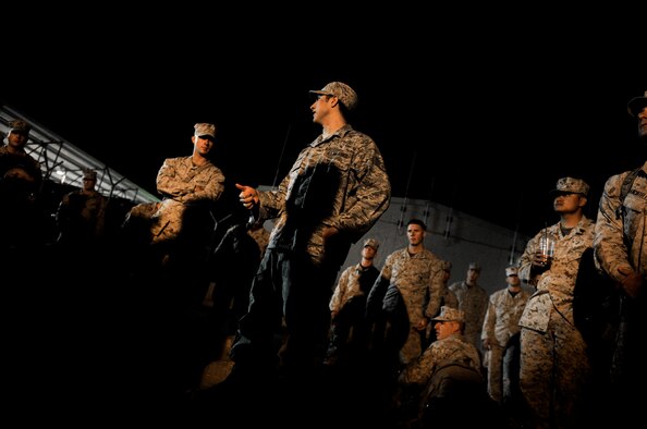 U.S. Air Force Staff Sgt. Edger Gaitan, Passenger Service NCOIC, 376th Expeditionary Logistics Readiness Squadron, instructs U.S. and coalition members on passenger procedures during his shift at Transit Center at Manas, Kyrgyzstan, Sept. 19, 2012. Gaitan also is a devout Muslim who finds the time to pray daily in between mission requirements here at Manas. Gaitan has had the priveledge of serving his country while helping to mentor those around him with his strong personal values and religious beliefs. (U.S. Air Force photo/Staff Sgt. Clay Lancaster)
