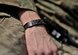 U.S. Air Force Airman 1st Class Tommy Allgier, Tactical Air Control Party member, wears a killed in action bracelet in memory of Maj. Walter Gray, who was KIA during a mission on Aug. 8, 2012. Gray was a fellow Joint Terminal Attack Controller and an Air Liaison Officer. The JTACs and TACP members that were under Gray's command wear the bracelets in memory of their fallen leader, who had a strong and lasting connection with his troops. (U.S. Air Force photo/Staff Sgt. Clay Lancaster)