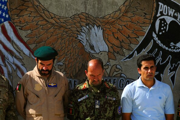 Members of the Afghan Air Force observe a moment of silence during the September 11 Memorial Ceremony, Sept. 11, 2012 at Kabul Afghanistan, International Airport Afghanistan. The ceremony was to honor those who lost their lives in the September 11 terrorist attacks and the men and women of the Department of Defense fighting the war on terrorism. (U.S. Air Force photo/Tech. Sgt. Quinton Russ/RELEASED)