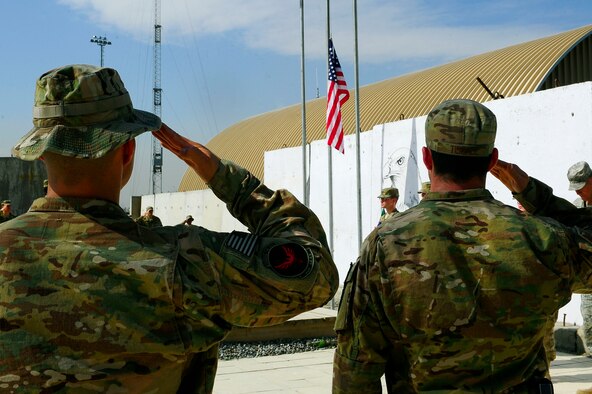 U.S. Air Force Senior Master Sgt. Eduardo Beltran and Senior Amn Robert Tisdale salute the flag while the national anthem plays during the September 11 Memorial Ceremony  Sept. 11, 2012 at Kabul Afghanistan, International Airport Afghanistan. The ceremony was to honor those who lost their lives in the September 11 terrorist attacks and the men and women of the Department of Defense fighting the war on terrorism. (U.S. Air Force photo/Tech. Sgt. Quinton Russ/RELEASED)