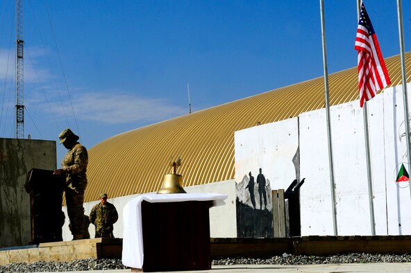 U.S. Air Force Master Sgt. Tammala Lawson, left, bows her head for a moment of silence during the September 11 Memorial Ceremony  Sept. 11, 2012 at Kabul Afghanistan, International Airport Afghanistan. The ceremony was to honor those who lost their lives in the September 11 terrorist attacks and the men and women of the Department of Defense fighting the war on terrorism. (U.S. Air Force photo/Tech. Sgt. Quinton Russ/RELEASED)
