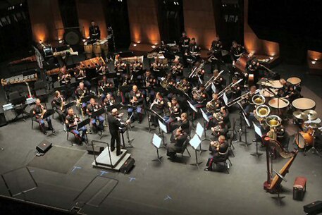 U.S. Marine Chief Warrant Officer 4 Michael Edmonson (On Podium) with the 1st Marine Division Band, conducts a concert at the Performing Arts Center in Escondido, Calif. April 23, 2009. The 1st Marine Division Band performs a concert in Escondido every year as an on going tradition for the citizens of Escondido. 
(U.S. Marine Corps photo by Cpl Jason T. Guiliano/Released)
