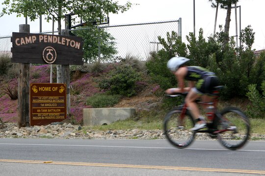 More than 2,400 Marines and civilians biked 56-miles through base during the Ironman 70.3 Oceanside, Calif. triathlon March 30. The competitors swam 1.2-miles in the Oceanside Harbor, pedaled through base and ran 13.1-miles through the coastal streets of Oceanside. 