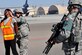 U.S. Air Force Senior Airman Amber Ricketson, 380th Expeditionary Security Forces Squadron quick response force, apprehends an intruder played by Staff Sgt. Tiffany Cooke, 380 SFS training member, while Staff Sgt. Daniel Kaltenegger, 380 SFS patrolman, provides cover during a base defense exercise at an undisclosed location in Southwest Asia Mar. 29, 2013. The exercise objective was to test the security forces reaction-time in the event that intruders threatened Air Force assets. Ricketson is deployed from Joint Base Lewis-McCord, Wash., Cooke is deployed from Wright-Patterson AFB, Ohio and Kaltenegger is deployed from Pennsylvania Air National Guard. (U.S. Air Force photo by Tech. Sgt. Christina M. Styer) 

