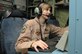 Senior Airman Whitni Orgass, 41st Expeditionary Electronic Combat Squadron cryptological language analyst, works at her station aboard an EC-130 Compass Call aircraft on Bagram Airfield, Afghanistan, March 23, 2013. The 41 EECS flies nightly missions in support of troops on the ground. (U.S. Air Force photo/Staff Sgt. David Dobrydney) 

