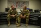 Capt. Justin, left, 361st Expeditionary Reconnaissance Squadron chief of scheduling, and Lt. Col. Robert, right, 62nd ERS remotely piloted aircraft pilot, sit together, March 4, 2013, on Kandahar Airfield, Afghanistan. Robert is deployed at the same time to the same location as his son, Justin. (U.S. Air Force photo by Staff Sgt. Marleah Miller)