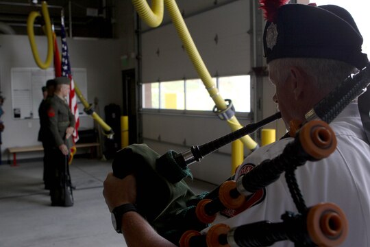 Dennis Rogers plays the bagpipe as Security and Emergency Battalion Color Guard “post the colors” during the dedication ceremony of Pendleton’s Fire Station 10 in honor of Sgt. Brian E. Dunlap here April 6. Rogers is a pipe major with the San Diego County Firefighters Pipes and Drums band. Dunlap was an advisor for the Iraqi Army and firefighter with the Camp Pendleton Fire Department and in 2005 and was killed by an improvised explosive device while conducting combat operations against enemy forces in Abu Fleiss, Iraq. 