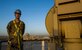 Airman 1st Class Alexander, 62nd Expeditionary Reconnaissance Squadron ground control station communications technician, poses on a ground data terminal tower, March 13, 2013, on Kandahar Air Field, Afghanistan. As a GCS communication technician, Alexander manages the communications in the cockpit that is used to fly remotely piloted aircraft. (U.S. Air Force photo by Staff Sgt. Marleah Miller)