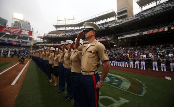 Marines with 1st Marine Logistics Group and other military units throughout California salute the flag during a San Diego Padres Military Appreciation Day event at Petco Park, April 14, 2013. The Major League Baseball team hosts these events regularly to show their appreciation for the large military influence present in California.