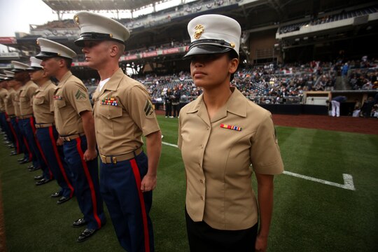 Marines with 1st Marine Logistics Group and other military units throughout California stand at attention during a San Diego Padres Military Appreciation Day event at Petco Park, April 14, 2013. The Major League Baseball team hosts these events regularly to show their appreciation for the large military influence present in California.